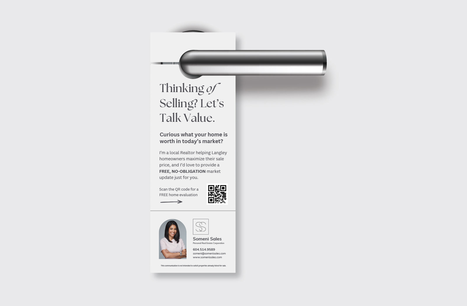 High-quality real estate door hanger hanging on a residential front door handle.
